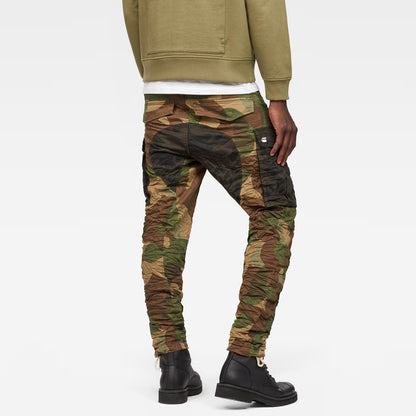 Back view of the green tapered pants showcasing the camouflage design and cargo pockets.