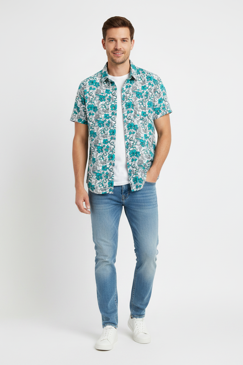 Man in MNG slim fit short-sleeve shirt with teal floral print and jeans