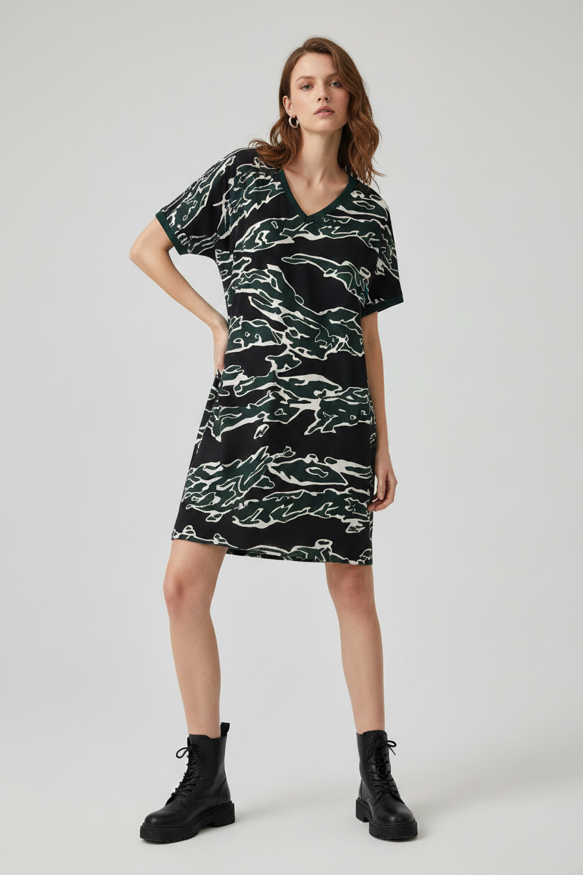 Model wearing black and white camo v-neck dress