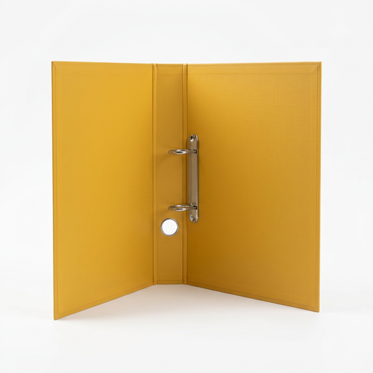 Open yellow two-ring binder on a clean white studio background