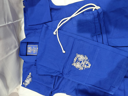 Blue judo gi trousers with white drawstring and embroidered badge