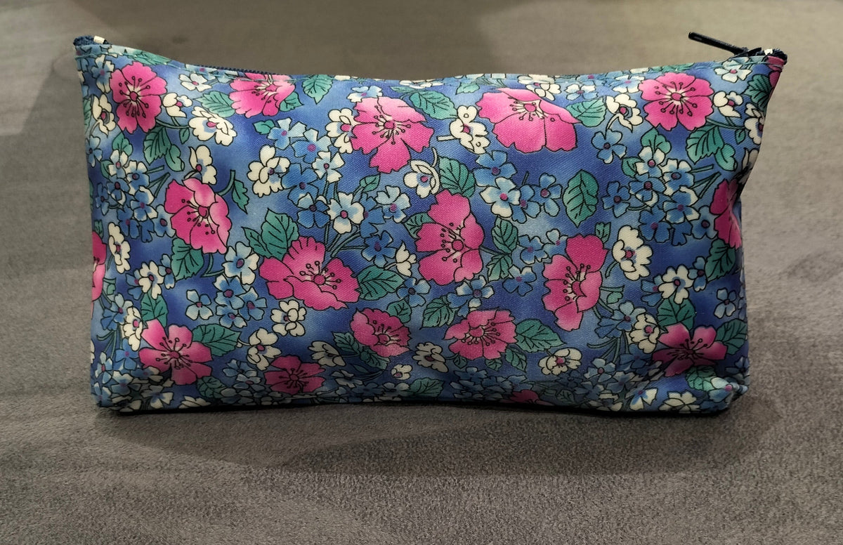 Zippered Blue Cosmetic Pouch With Floral Patterns