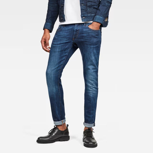 G-Star Raw 3301 deconstructed super slim dark blue jeans worn with black boots, front view