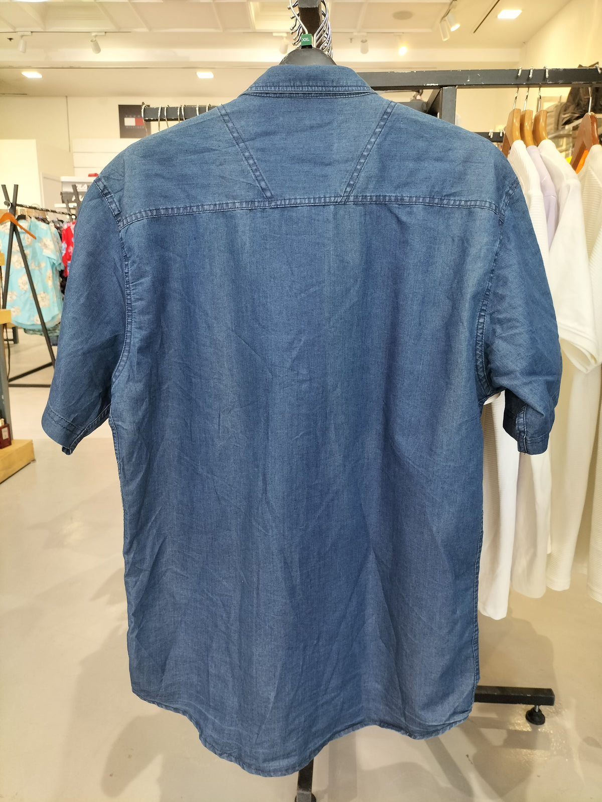 Back of Petrol blue denim short-sleeve shirt on hanger