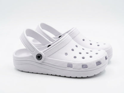 Pair of white foam clogs with heel straps, angled side view