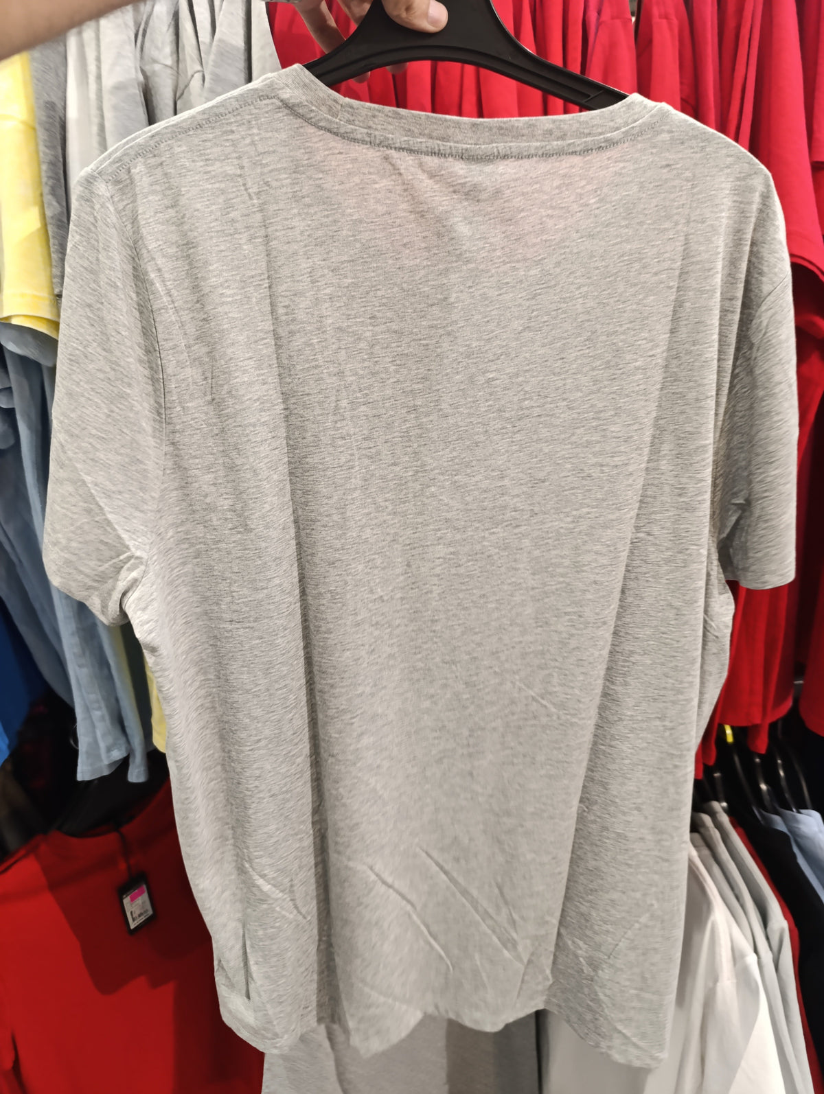 Heather grey plain crew-neck T-shirt hanging in store, back view