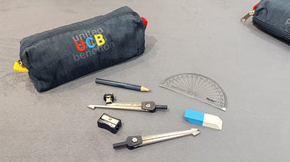 Benetton navy pencil case shown with scissors, sharpener and other stationery
