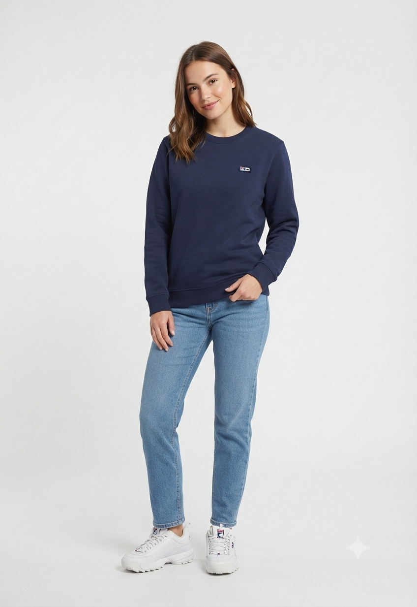 Woman wearing Fila navy embroidered logo sweatshirt with light jeans, full length