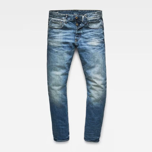 Front view of blue distressed jeans featuring a slim fit on a white background.