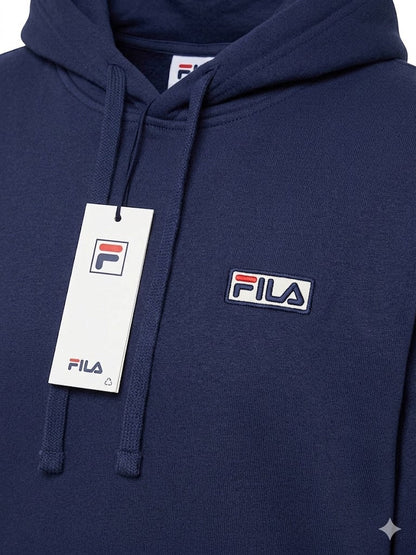 Close-up of Fila logo patch and tag on navy hoodie