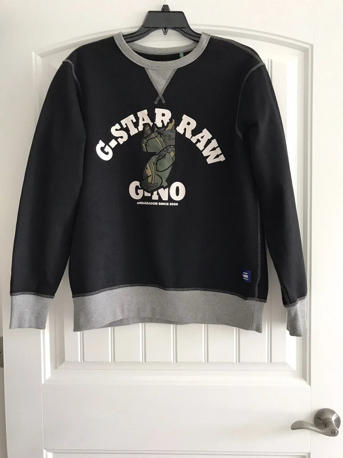 Black G-Star Raw Gino sweatshirt with white G-Star Raw graphic and grey trim on hanger